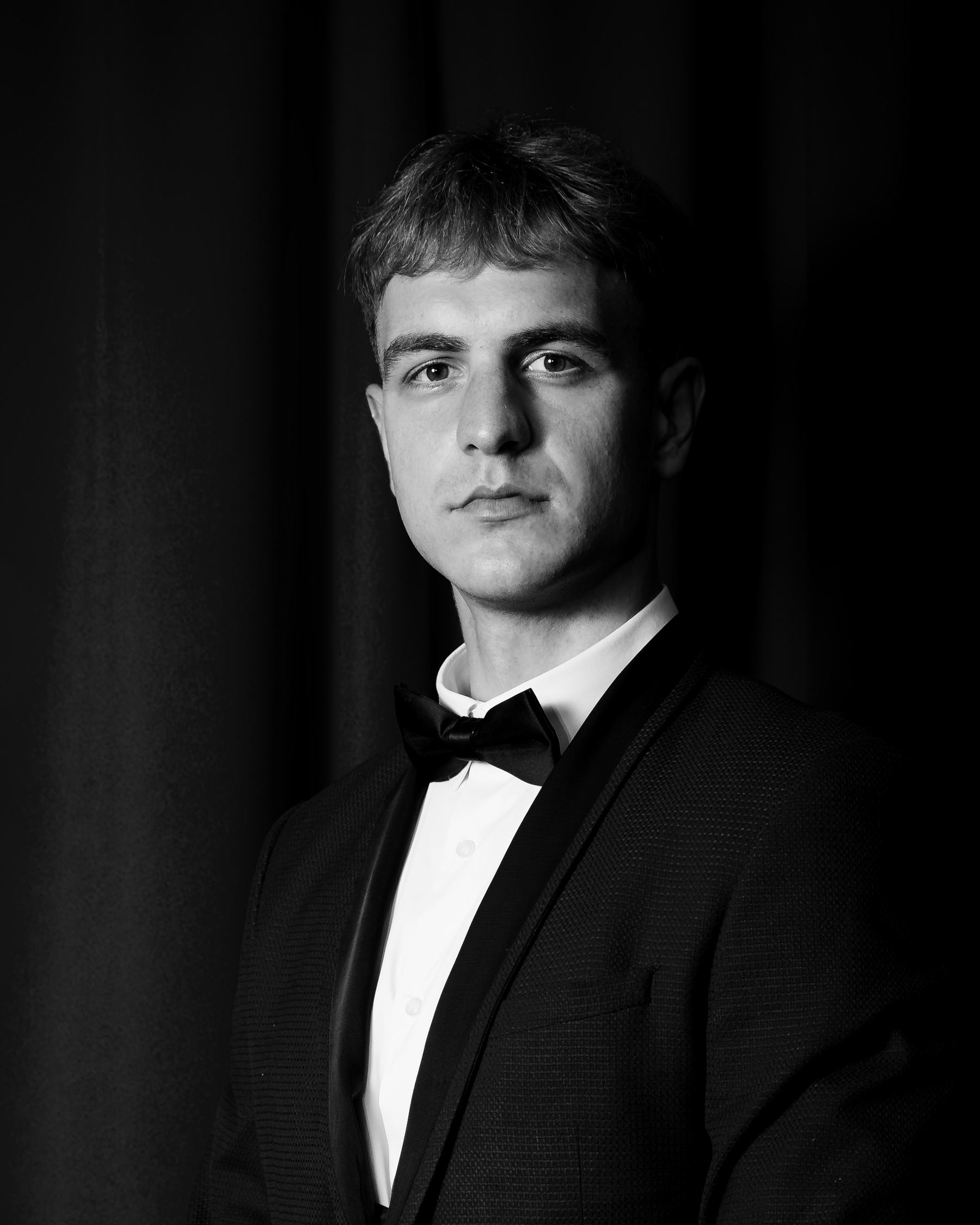Ivas, founder of Brand Empire Club, in a black tuxedo